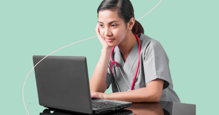 nurse studying on a laptop