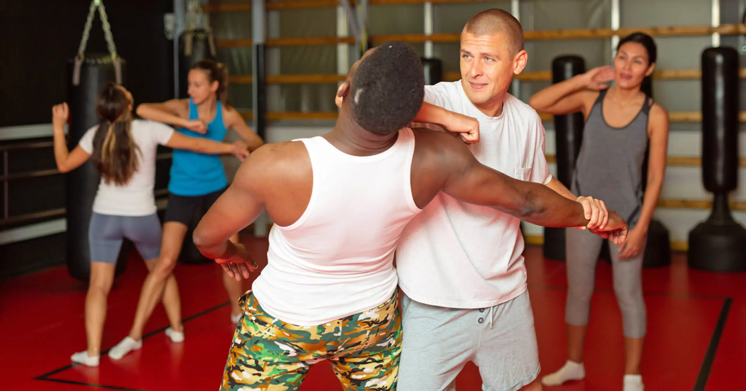 Safety tips - men and women taking self-defense class