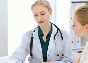 Nurse practitioner talking with patient