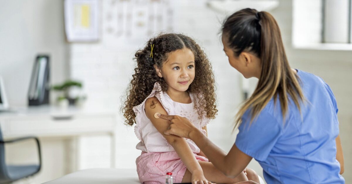 LPN giving pediatrics patient a vaccination