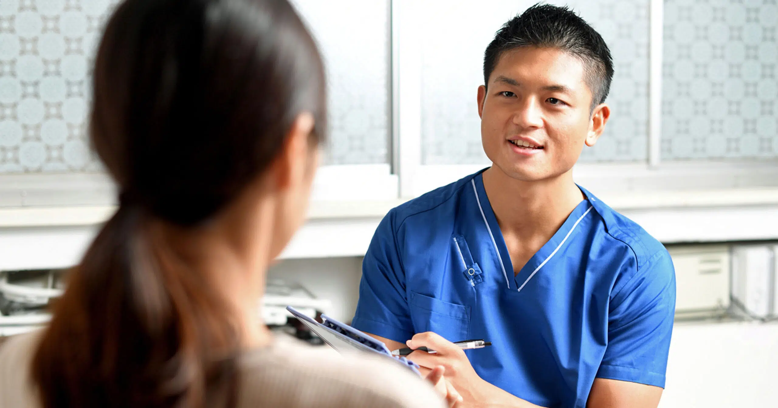Male nurse with patient