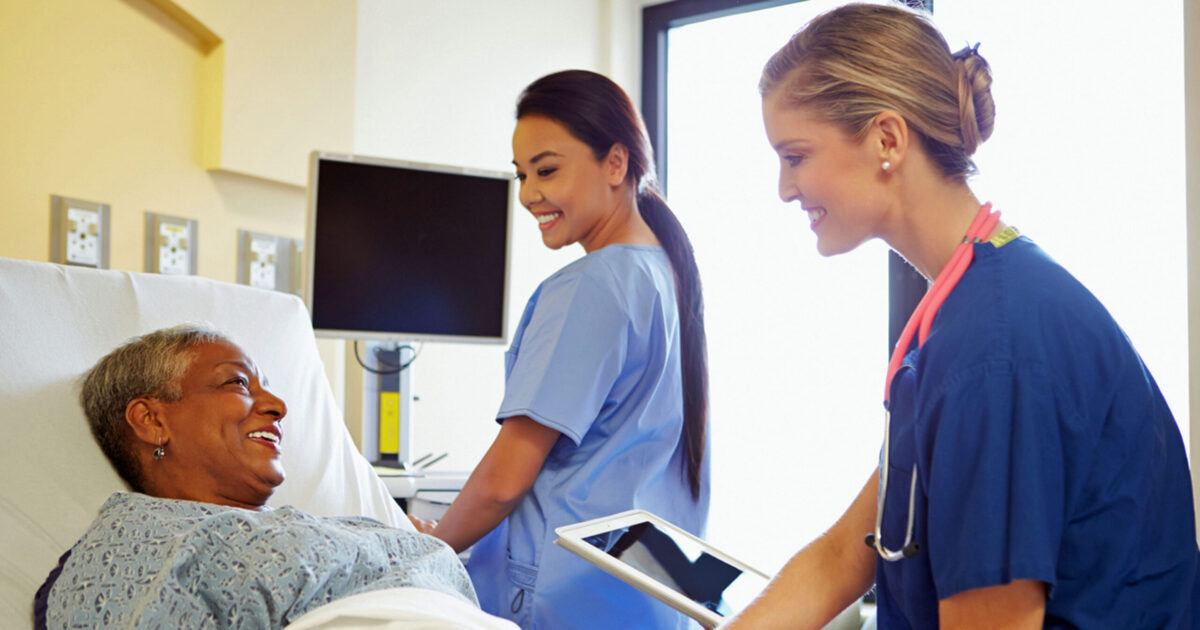 Two nurses with patient