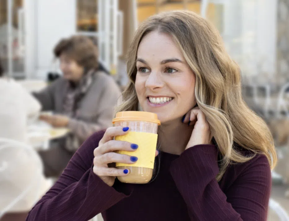 Nurse enjoying coffee during a break outside.
